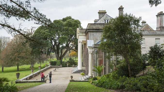 Visitors in autumn on the terrace of Trelissick House